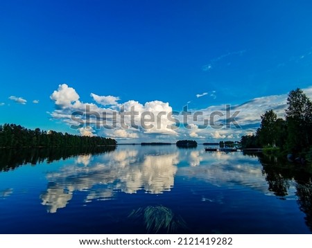 reflection of clouds on the lake sky and clouds, beautiful photo digital picture , picture taken in Sweden, Europe , Digital created image Picture