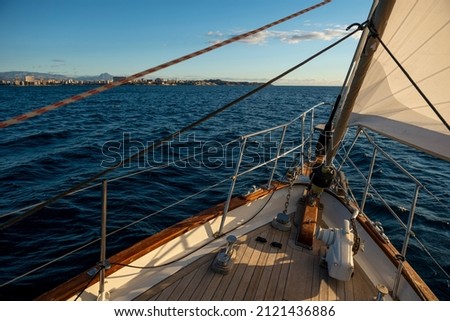 Sailing against the wind through the waves, Alicante bay, Costa Blanca, Spain