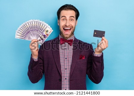 Photo of elegant ecstatic yelling man win money lottery advertise credit card bank isolated on blue color background