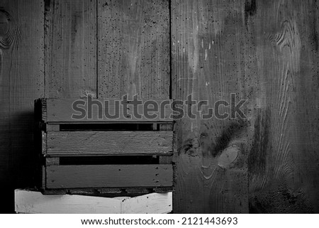 old planks damaged by worms, shown up close, doors painted black, planks joined together