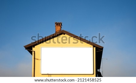 house facade with advertising billboard. empty space for your text. complete with track