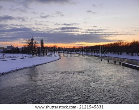 Sunset over the river in winter.