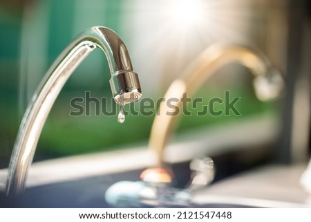 Leaking Faucet and drop of water,  Close up shot Royalty-Free Stock Photo #2121547448