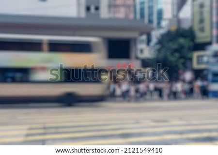 Blurred abstract background of people walking on the street in Hong Kong
