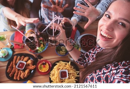 Group of people doing selfie during lunch. Self. Friends. Friends are photographed for eating