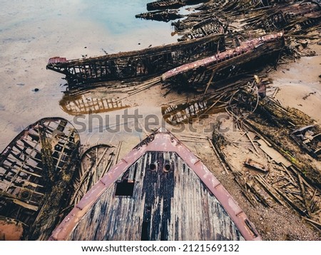 Cemetery of old ships in Teriberka Murmansk Russia, dramatic photo. Aerial top view.