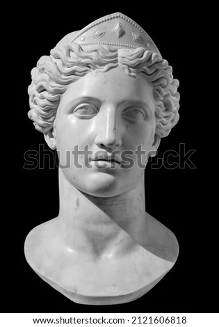 Gypsum copy of ancient statue Venus head isolated on black background. Plaster sculpture woman face