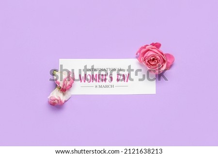 Greeting card for International Women's Day and flowers on lilac background Royalty-Free Stock Photo #2121638213