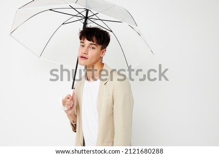 Man transparent umbrella a man in a light jacket Lifestyle unaltered