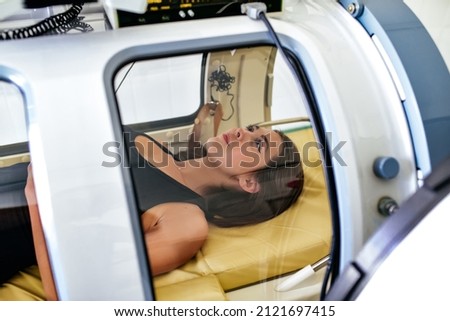 oxygen pressure chamber is being treated. Treatment of pneumonia and covid. Royalty-Free Stock Photo #2121697415