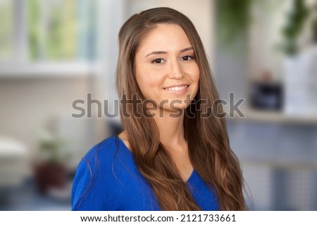 Headshot portrait of smiling professional female advisor, business lady coach looking at camera