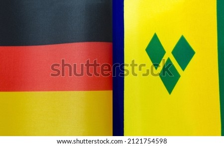 fragments of the national flags of Germany and Saint Vincent and the Grenadines close-up