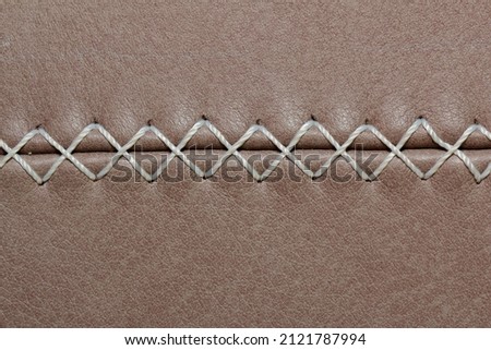 decorative seam on calfskin made of nylon thread Royalty-Free Stock Photo #2121787994