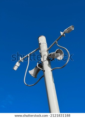 Surveillance camera on street lamp background bluesky