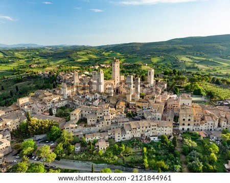 Aerial view of famous medieval San Gimignano hill town with its skyline of medieval towers, including the stone Torre Grossa. UNESCO World Heritage Site. Province of Siena, Tuscany, Italy. Royalty-Free Stock Photo #2121844961