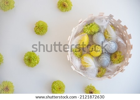 Spring flowers and colored easter eggs