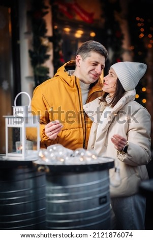 Loving couple in winter in New Year's locations