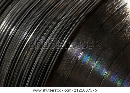 Vinyl LP Record grooves for musical background. Before streaming, Long Playing records were the musical medium standard until the late 20th century.