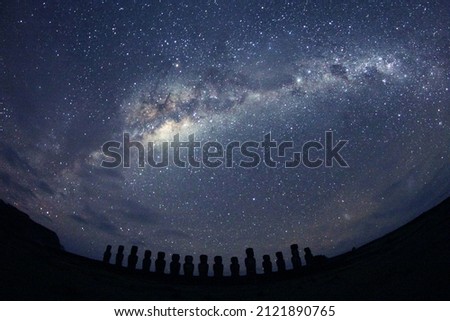 Fisheye shot of the Milky Way over Moai statues on Easter Island