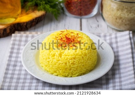A plate of saffron rice pilaf (Turkish name; safranli pilav) Royalty-Free Stock Photo #2121928634