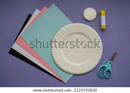 How to make paper bunny for Easter greetings. Children art project. Step by step photo instruction. DIY concept. Very Peri background color 2022. Flat lay. Step 1. Preparation for making.