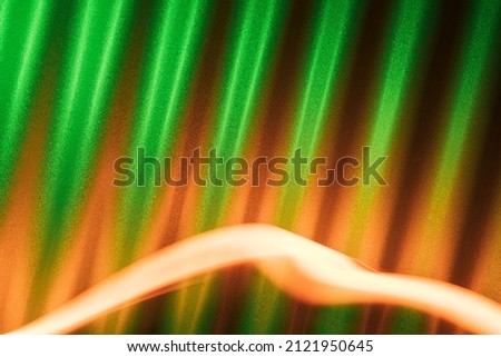 Ireland flag colors abstract background with corrugated metal and orange lights. St Patrick's day abstract backdrop.