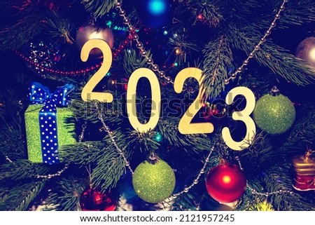 happy new year 2023 background new year holidays card with bright lights, gifts