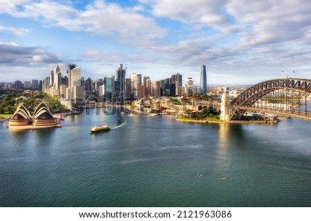 Waterfront architectural landmarks of Sydney city CDB around Circular quay and the Rocks on shores of Harbour in aerial cityscape. Royalty-Free Stock Photo #2121963086