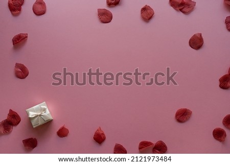 Valentine's day card background with rose petals and gift box| Top View Royalty-Free Stock Photo #2121973484