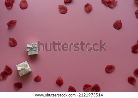 Valentine's day card background with rose petals and gift box| Top View Royalty-Free Stock Photo #2121973514
