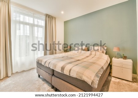 Beautiful bedroom in new luxury home with some decor Royalty-Free Stock Photo #2121994427