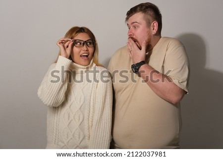 Man and woman on a gray background