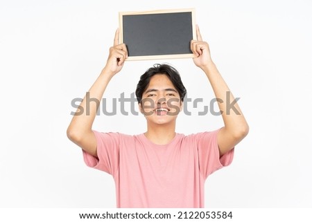 Showing, Presenting and holding Blank Blackboard of Asian Man Wearing T-shirt Isolated On White Background