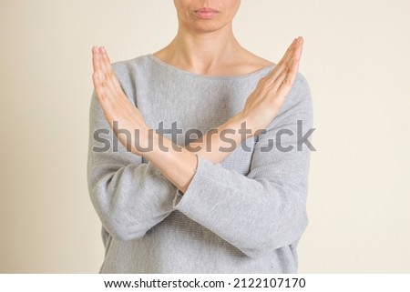 Crossed hands. Break the bias symbol of woman's international day. Woman arms crossed to show solidarity, commitment to calling out bias, breaking stereotypes, inequality, rejecting discrimination Royalty-Free Stock Photo #2122107170