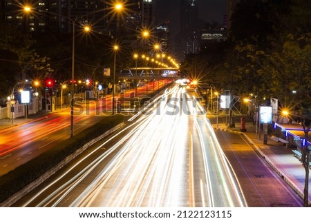 blurred night light on the road capturing with long exposure, Bangkok, Thailand