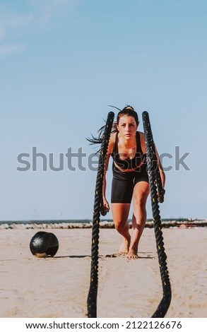 Functional training workout on the beach, fit and athletic woman doing sport outdoors - Concepts about lifestyle, sport and healthy lifestyle