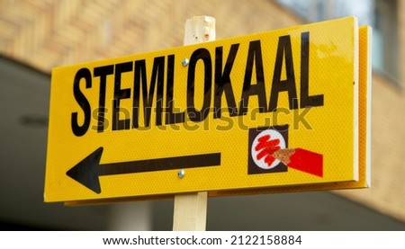 Yellow sign referring to the polling station for municipal elections in the Netherlands. Stemlokaal voor verkiezingen.