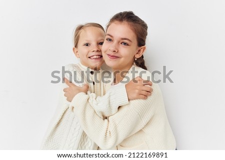 two little girls girlfriends posing light background