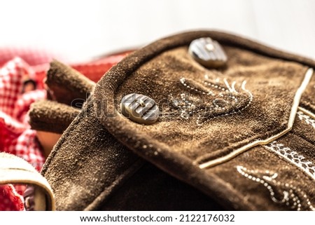 Close-up of details of a bavarian folk costume leather pants Royalty-Free Stock Photo #2122176032