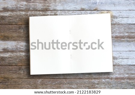 Top view with blank notebooks on wood table background in office workplace. Inspiration ideas.Creative flat lay photo of workspace desk.