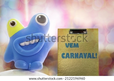 Vem Carnaval is Carnival is coming in Portuguese language. Popular Event in Brazil. Festive Mood. Carnival announcement and funny abstract creature on a light background with bokeh.