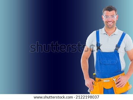 Portrait of caucasian male repairman smiling with copy space on blue background. repair and maintenance service concept