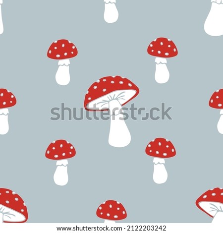 Seamless vector pattern with hand drawn toadstool on grey background. Simple cartoon mushroom wallpaper design. Decorative autumn fashion textile. Royalty-Free Stock Photo #2122203242
