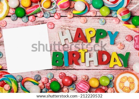 White sheet on candy and sweets. space to insert photos and captions for greetings or announcements