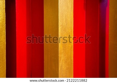 Background image with red and gold interspersed.