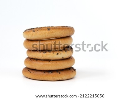 group of bagels with poppy seeds isolated on white background, side view, food bakery concept