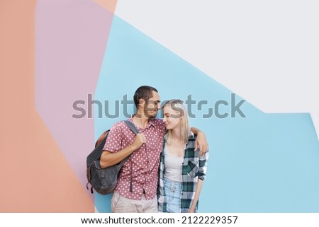 Shot of a cheerful young couple standing outside holding each other in a gentle way Royalty-Free Stock Photo #2122229357