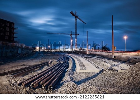 Construction site of railroad track. Building of new tram connection in city. Royalty-Free Stock Photo #2122235621
