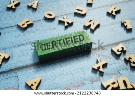 Certified wording with scattered word over a blue background