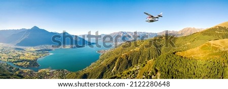seaplane in flight over Lake Como, Italy Royalty-Free Stock Photo #2122280648